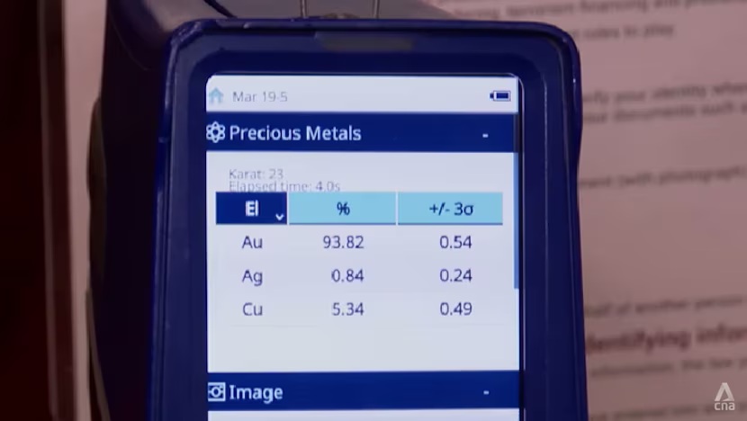 A analyzer is used to measure the chemical composition of a gold bar, which has a 93.82 per cent purity, in a shop.